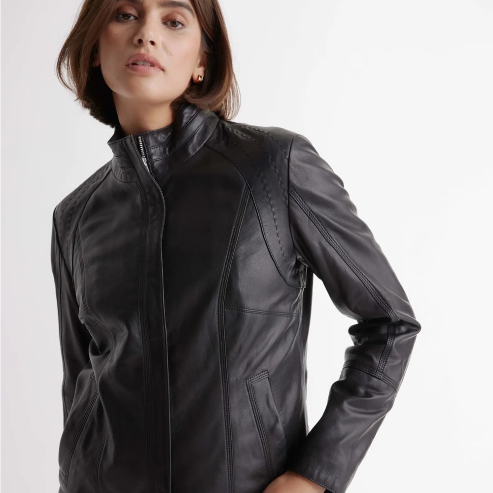 Women’s black leather jacket from Quince.